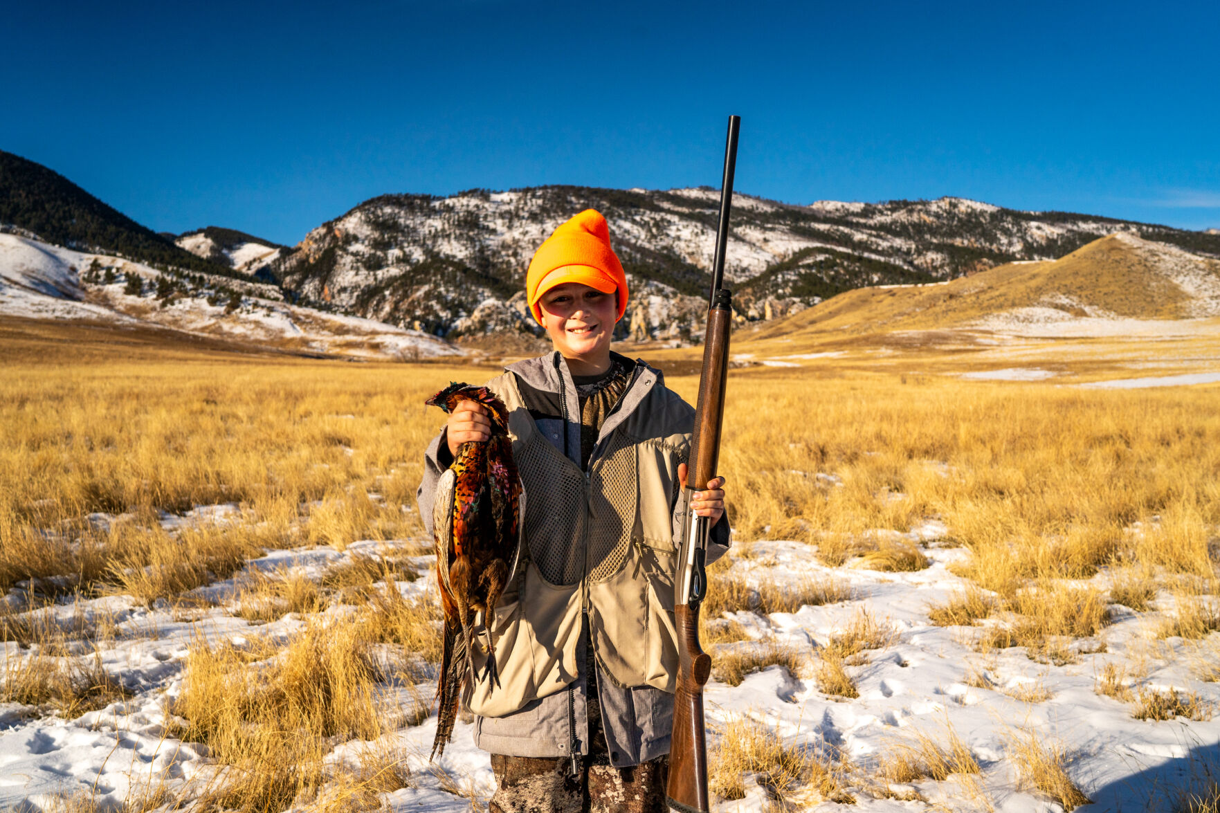 Henry Schoup holds up his pheasant